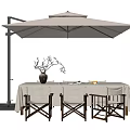 Outdoor Dining Table with Patio Umbrella Decorative Vase Branches and Wooden Chairs Setup