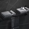 Modern Bathroom Accessories Black Towel Rack On Marble Wall With Gray Towels And Aromatherapy Diffuser
