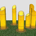 Bamboo Shaped Outdoor Lights Standing on Green Grass with Warm Yellow Glow in Night Scene