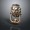 Brass Metal Door Knocker With Intricate Carved Human Face Design On Dark Background