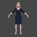 Woman with long blonde hair wearing dark blue V neck shirt against gray background