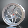 Stylish Car Wheel With Silver Spoke Design And Red Center Logo