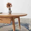 Natural Wood TV Stand In Modern Living Room With Coffee Table Oranges And Decorative Paintings