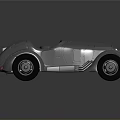 Silver Metallic Vintage Convertible Car With Streamlined Body And Black Wheels