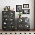 Black Plant Patterned Chest of Drawers With Potted Plants And Framed Artworks