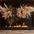 Modern Fireplace with Flames and Decorative Dried Plants in Black Backdrop