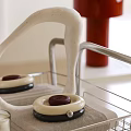 Modern Rolling Storage Rack with Toiletries Bottles Mirror and Towel on Bathroom Countertop