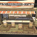 Vintage Food Truck With Outdoor Seating Striped Awning And Menu Board