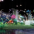 Magical Garden Decorative Scene With Large Flowers Paper Cranes Mushrooms And Tables