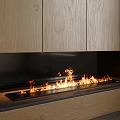 Modern Fireplace With Burning Fire Flames And Wooden Cabinets In Interior Design