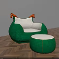 Green Armchair With White Cushion Orange Armrests And Matching Ottoman On Herringbone Wooden Floor