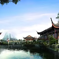 Traditional Ancient Architecture Showcasing Elegant Cornices Tranquil Pond And Stone Bridge