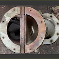 Old Rusty Metal Component With Peeling Paint Two Connecting Ports On Square Base