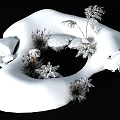 Snow Covered Garden Landscape With Evergreen Plants And Natural Stones