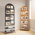 Black And Wooden Arched Bookcases With Photo Frames Books And Decorative Items Near Window