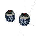 Traditional Ceramic Jars With Blue And White Floral Patterns And Red Top Accents