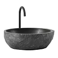 Elegant Round Dark Textured Stone Washbasin With Modern Black Faucet