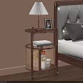 Wooden Bedside Table With Table Lamp Photo Frame Books And Rattan Basket Next To Bed