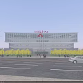 Modern Office Building With Solar Panel Roof Surrounding Trees Parking Lot And Road Access