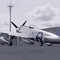 Vintage Silver Propeller Fighter Aircraft with US Star Insignia Parked on Runway Trees Sky Background