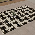Black And White Geometric Pattern Square Carpet On Wooden Floor With Vase And Books
