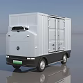 White Utility Vehicle Featuring Modern Box Body Front Logo Black Wheels On Smooth Reflective Surface