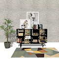 Modern Entryway Cabinet And Sideboard With Framed Artwork Potted Plant And Geometric Rug