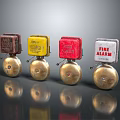 Classic Fire Alarm Devices With Multicolored Cases And Shiny Metal Bells