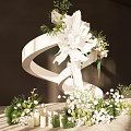 Elegant Romantic Floral Decoration With White Flowers Green Foliage White Ribbon And Small Bouquets