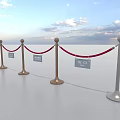 Red Rope Barriers With Gold And White Stanchions On White Floor Under Sky