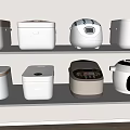 Various Modern Kitchen Appliances Displayed On Shelves In Kitchen