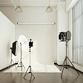 Professional Photography Studio Setup With Lights Reflectors And White Backdrop