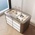 Modern Decorative Cabinet with White Drawers Displaying Jewelry Accessories and Flower Arrangement in Illuminated Compartments