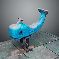 Blue Train Shaped Playground Ride On Stone Pavement With Fallen Leaves