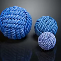 Three Blue Woven Textured Balls In Different Sizes And Gradient Colors 3d model