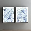 Two Botanical Prints With Blue And White Leaf Patterns In Black Frames On Gray Wall
