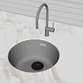 Round Black Kitchen Sink With High Arc Faucet On Marble Countertop