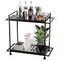 Modern Black Bar Cart Decor Setup With Wine Bottles Metal Containers Green Plant And Glasses