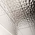 Textured Metallic Wall Decor With Geometric Patterns And Colorful Round Accents