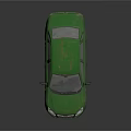 Old Green Sedan Car Featuring Worn Exterior And Dusty Body