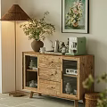 Wooden Sideboard with Glass Doors and Dinnerware Inside Potted Plant Floor Lamp and Wall Art