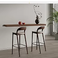 Modern Wooden Bar Counter With Bar Stools Vase Red Apples And Large Green Plant