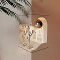 Elegant Wall Lamp with Winged Statues Near Stairs and Arched Doorway and Palm Leaves