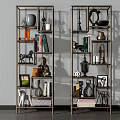 Modern Metal Shelving Unit With Decorative Books Sculptures Vases And Photo Frames