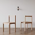 Two Minimalist Wooden Leisure Chairs In Bright Room With White Wall And Smooth Wooden Floor