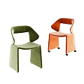 Two Modern Velvet Accent Chairs in Green and Orange with Curved Back Design