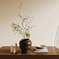 Brown Textured Ceramic Vase With Natural Dried Branches And White Blooms On Wooden Table