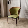 Elegant Green Upholstered Dining Chair With Brown Wooden Frame Golden Legs On Wooden Floor With Green Plant
