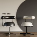 Wabi Sabi Style Black And White Leather Dining Chairs With Rounded Backrest And Metal Legs