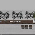 Wooden Tea Table and Chairs with Green Plant and Tea Set on Top